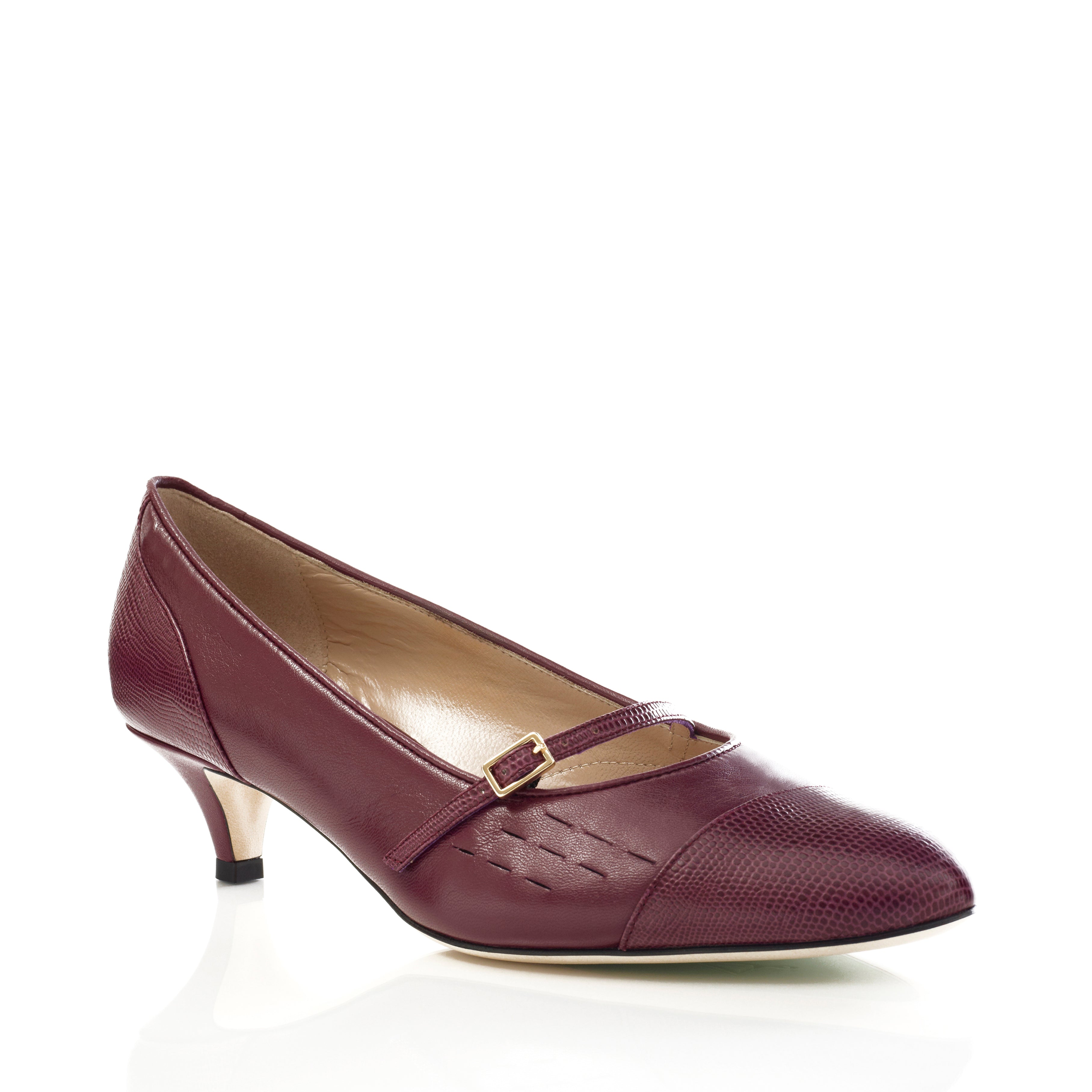 A single women's pump shoe in burgundy textured leather with a kitten heel and a small gold buckle detail, shown on a clean white background.