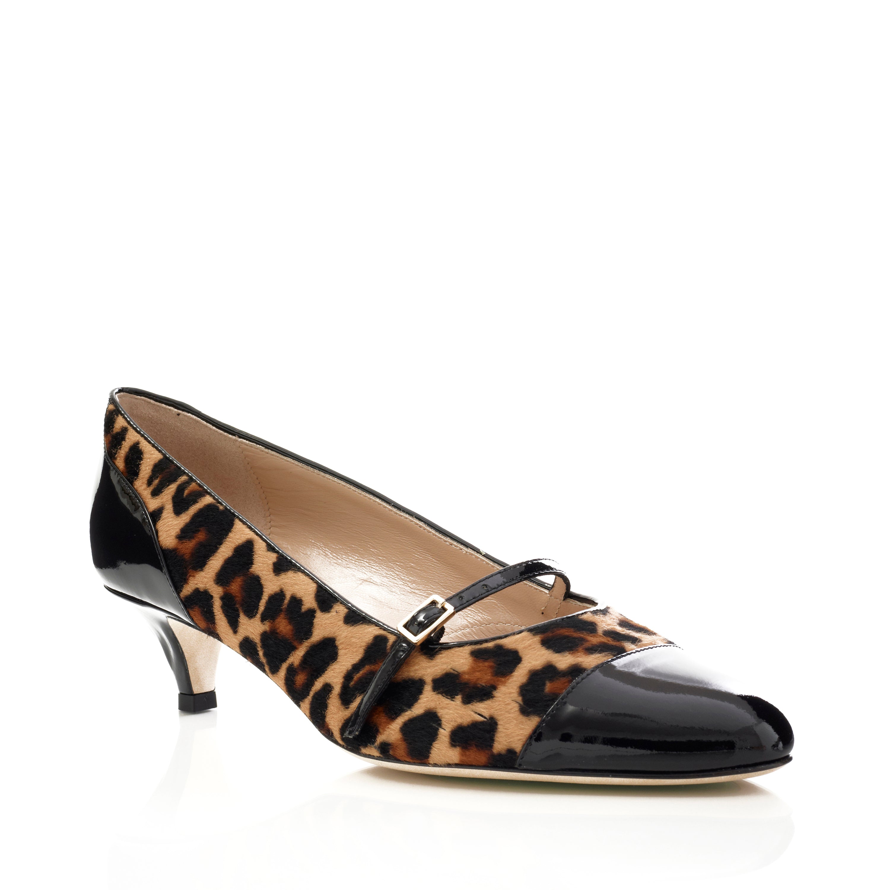 Black patent leather shoe with a pointed toe and thin heel on a white background