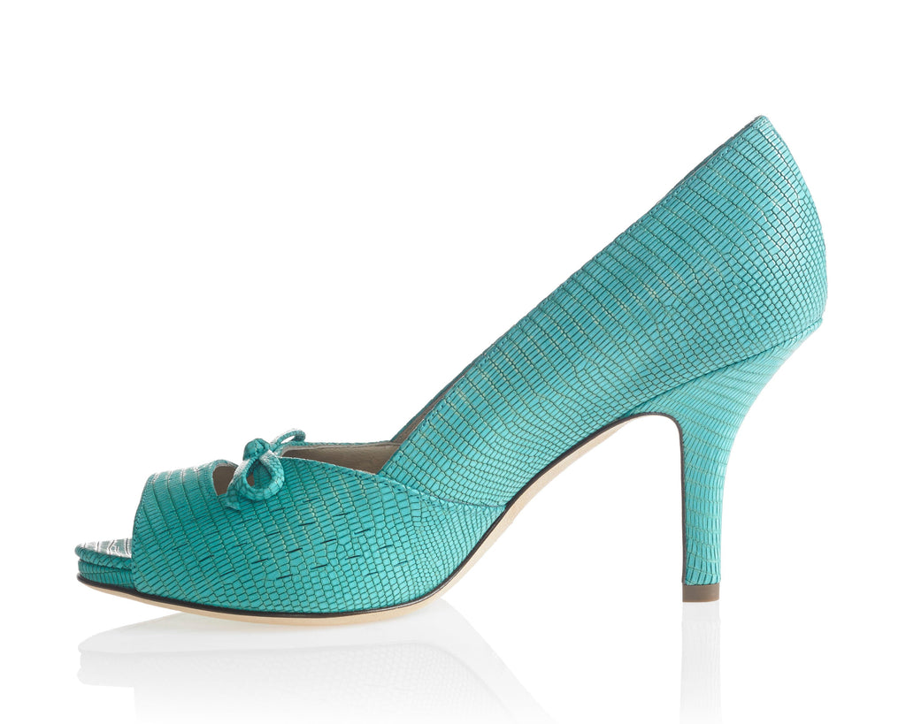 Gracie single teal textured high-heeled pump with an open toe and a small bow detail on the vamp, shown against a white background with a soft reflection.